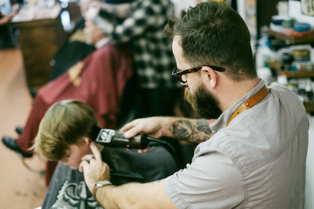 man-shaving-the-boys-hair-arxazjt5k2a